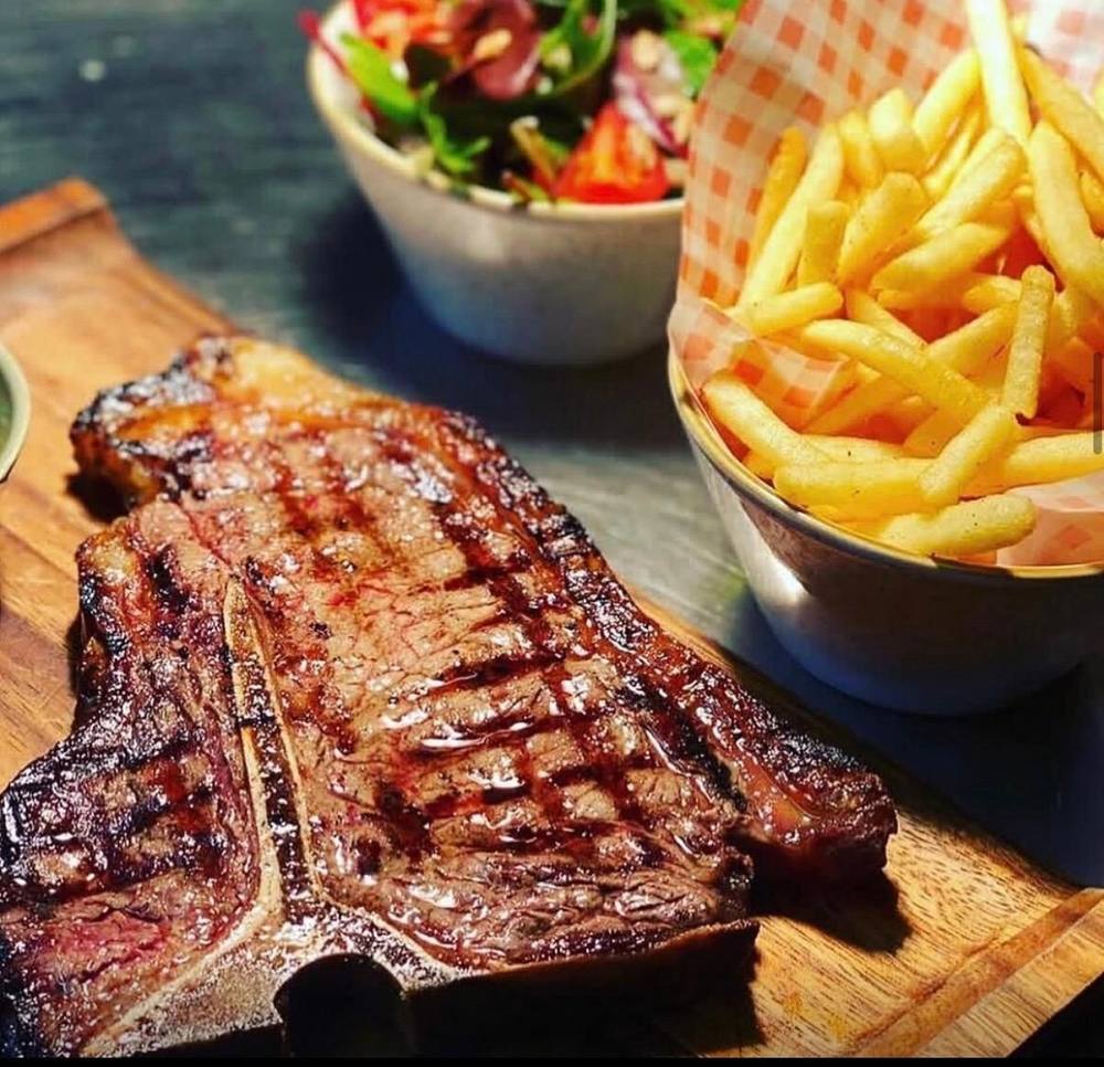 16oz T-bone steak with chips and salad at Wood Grill at The Queen Adelaide