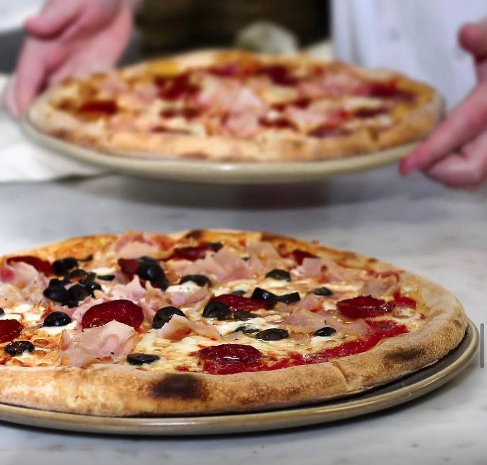 Wood-fired pizzas at Wood Grill at The Queen Adelaide